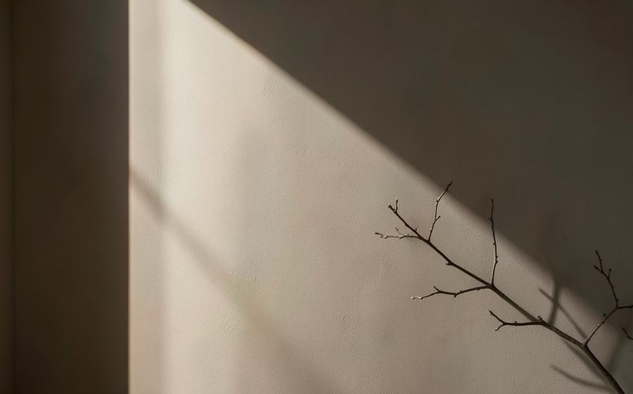 Warm window light and shadow in a quiet interior